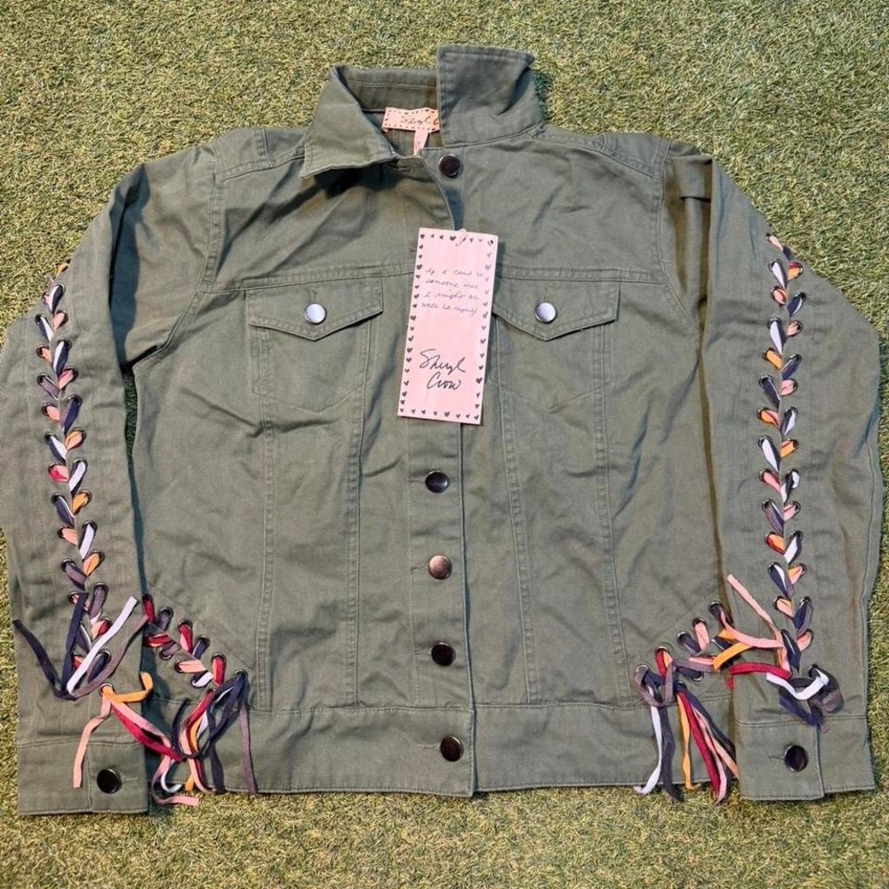 Green military jacket with colorful ribbon details #military #festival